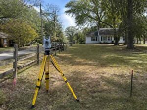 Local surveyor in Newnan GA reviewing property boundaries, access points, and site conditions on a residential lot.